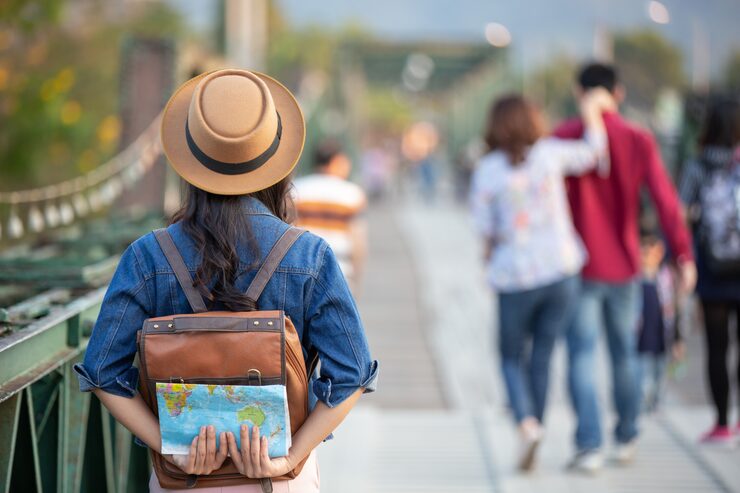 female tourists hand have happy travel map 1150 7412