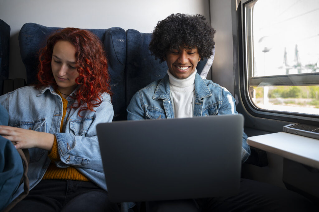 medium shot friends traveling by train