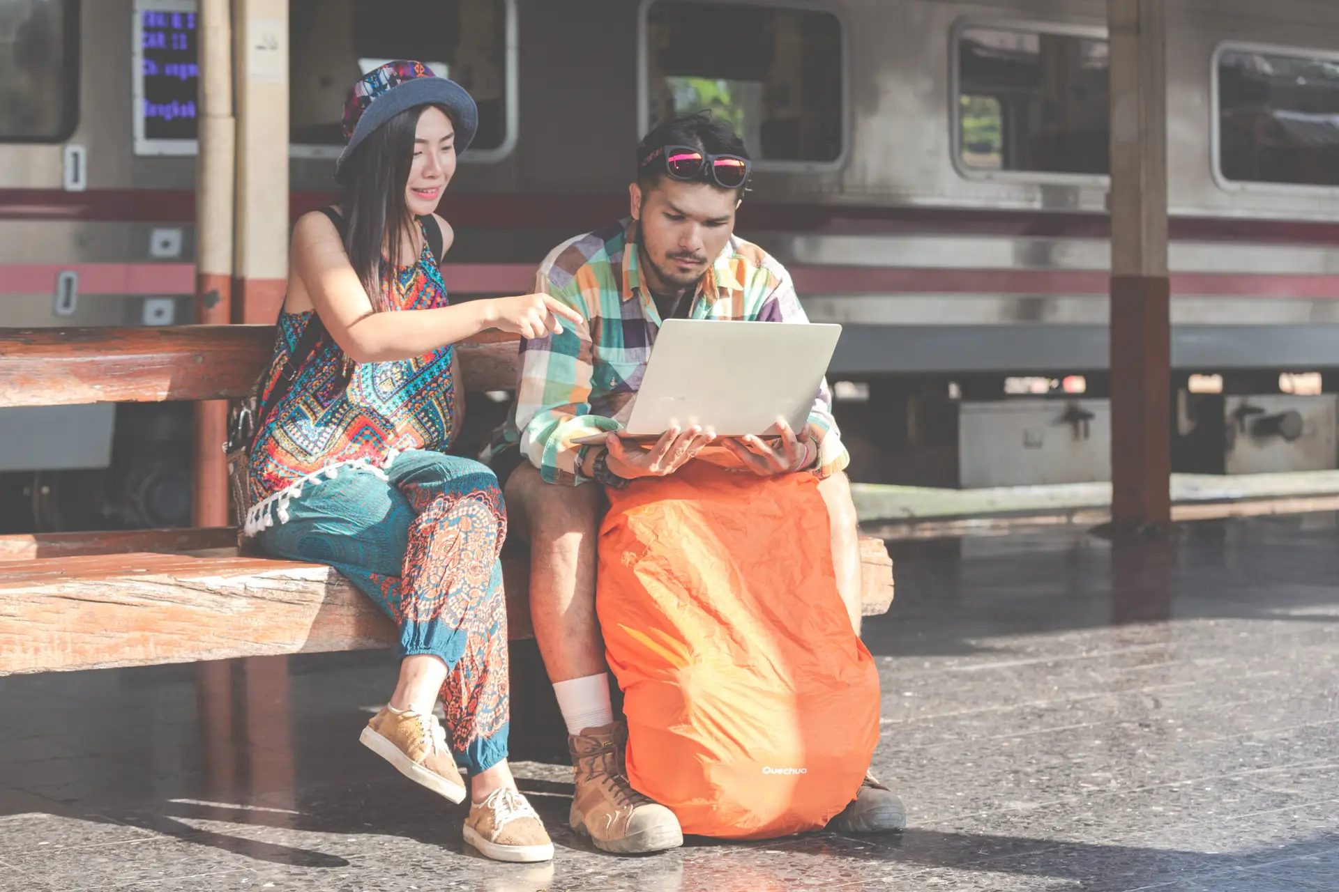 Home tourists, couples looking at tablets to find attractions.